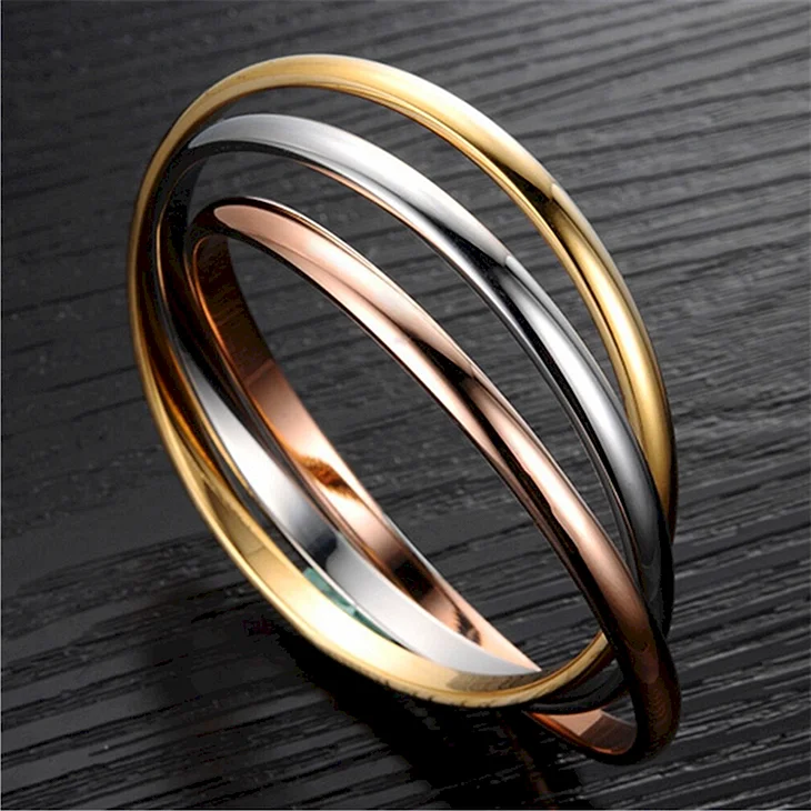 Cartier Trinity браслет золотой