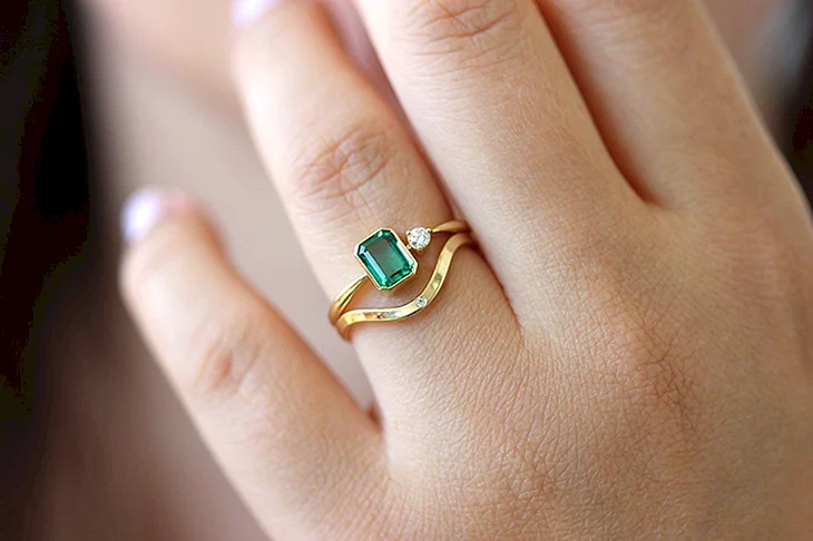 Ring with an Emerald on the little finger